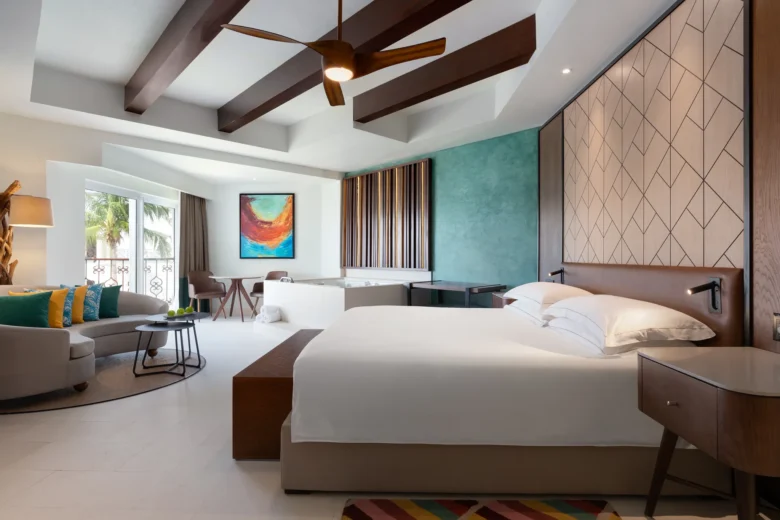 One Bedroom Suite King bedroom with jetted tub and modern décor at Hyatt Vivid Playa del Carmen.