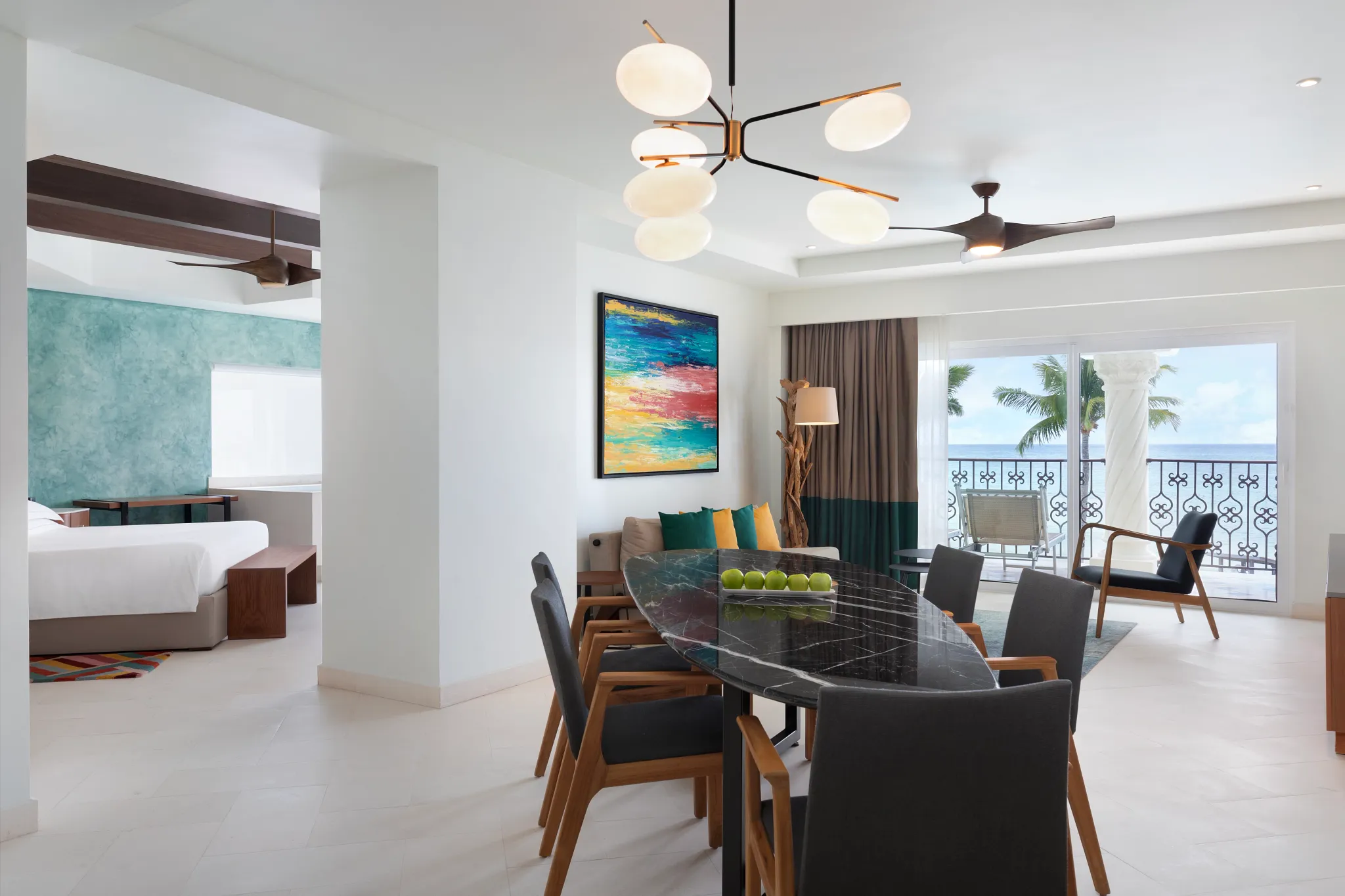 One Bedroom Suite Oceanfront King with dining area and ocean view balcony at Hyatt Vivid Playa del Carmen.