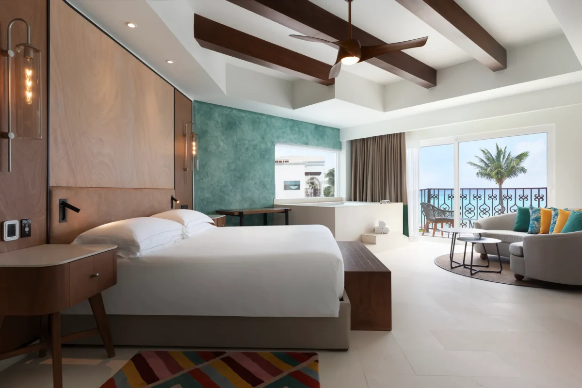 One Bedroom Suite Oceanfront King bedroom with ocean view balcony at Hyatt Vivid Playa del Carmen.