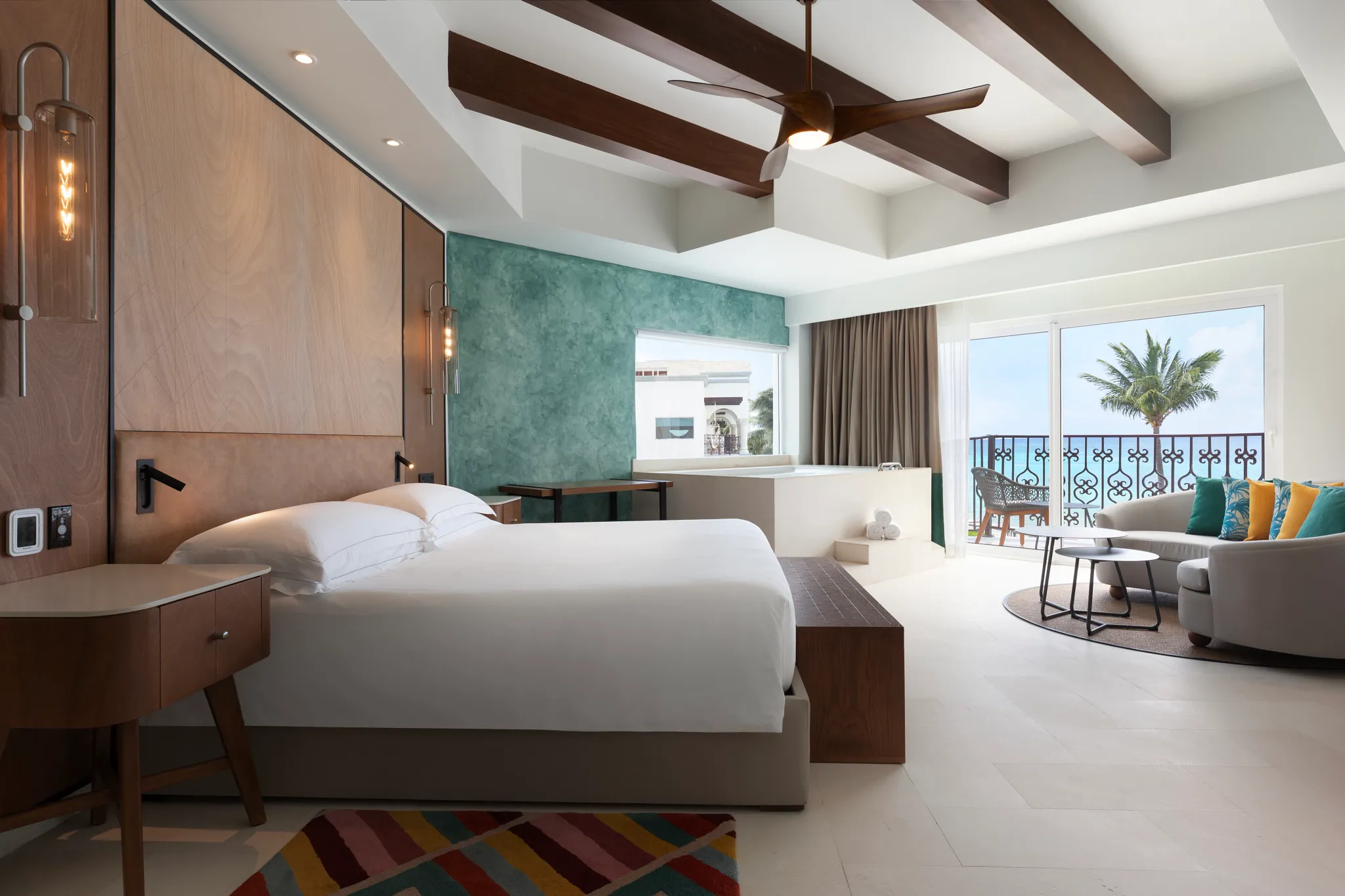 One Bedroom Suite Oceanfront King bedroom with ocean view balcony at Hyatt Vivid Playa del Carmen.